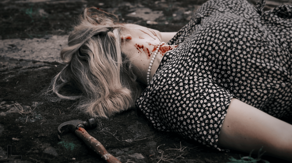 A victim and the murder weapon at a murder mystery event