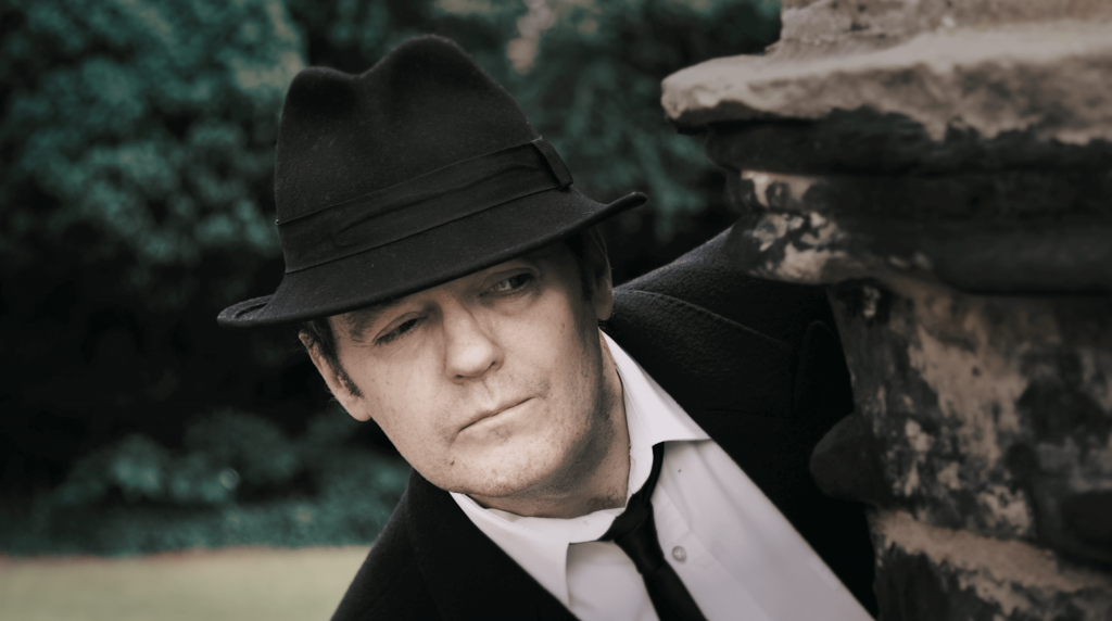 A detective looking for clues at a murder mystery event