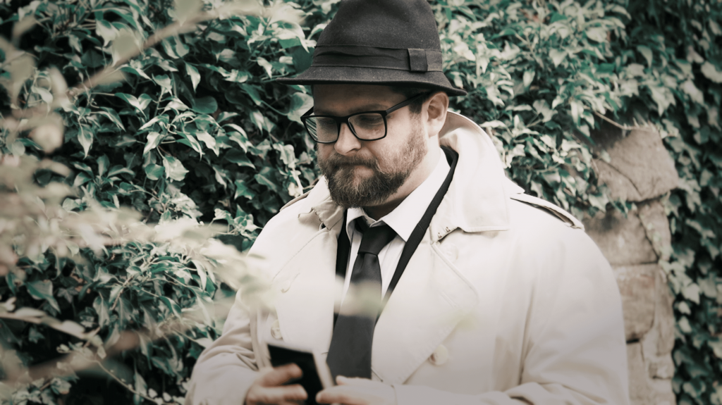 A detective trying to solve the case at a murder mystery