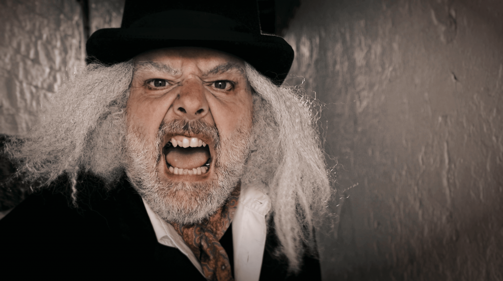 Scrooge shouting at a murder mystery event